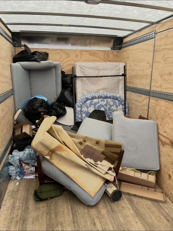 Unwanted furniture loaded into a trailer