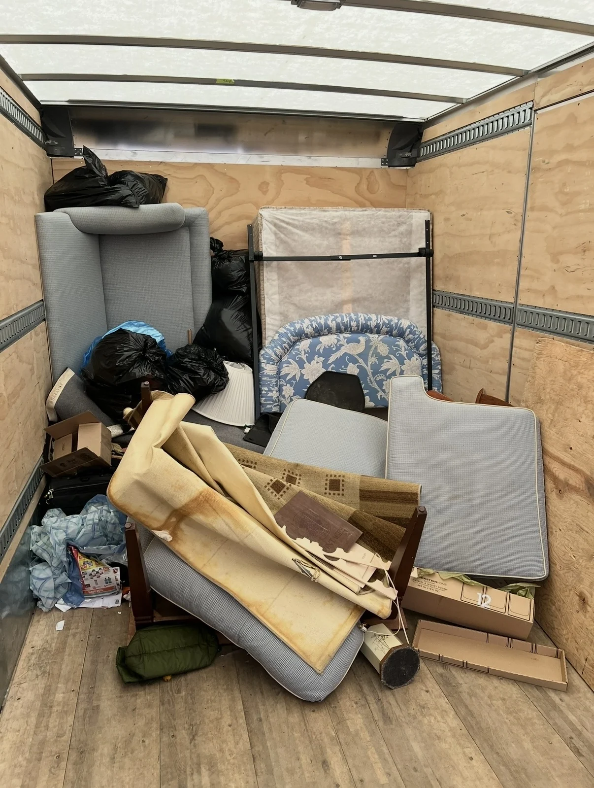 Trailer loaded with unwanted furniture and household items