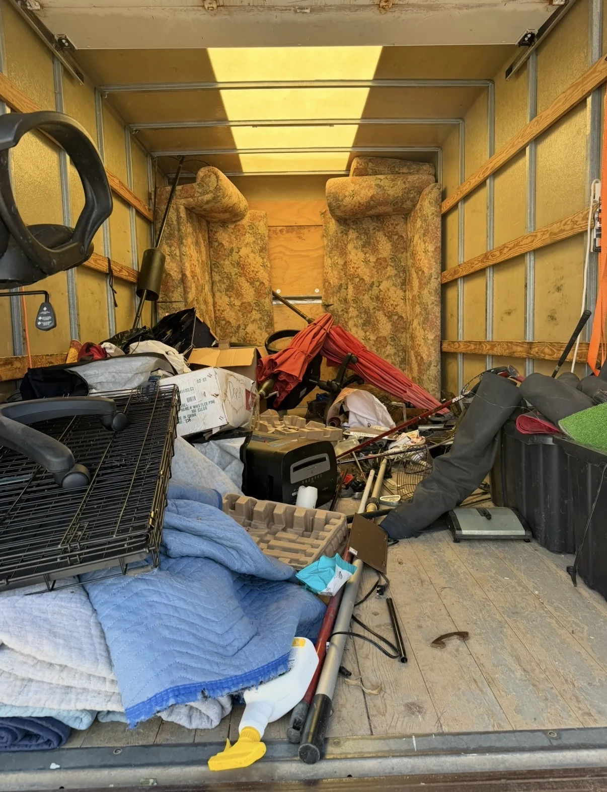 Truck loaded with furniture and household junk for removal